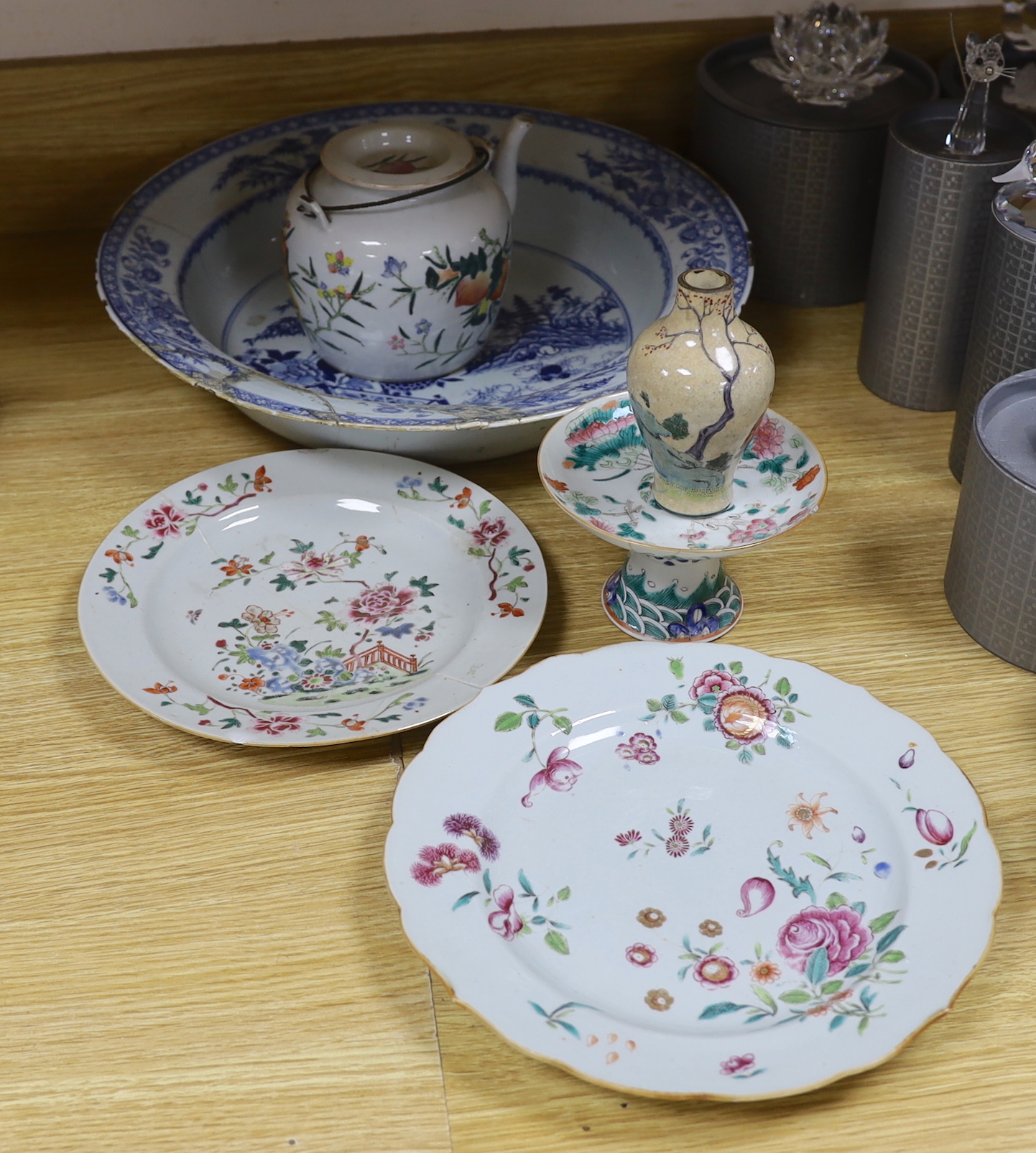 An 18th century Chinese blue and white basin, two plates, and an early 20th century Chinese teapot, footed dish and a vase